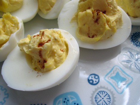 deviled eggs on a blue and white plate