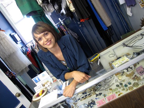 Swift Vintage Shoppe counter with a woman smiling 