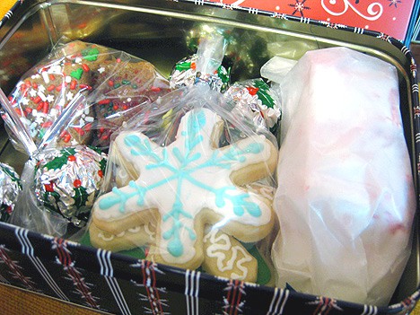 Decorated Sugar Cookies, Oreo Truffles, Peppermint Marshmallows and Gingerbread Cookies, wrapped in cellophane bags inside a box
