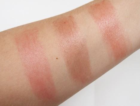 woman's arm with swatches of burts bees lip balms