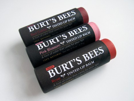 burts bees lip balms on a white table