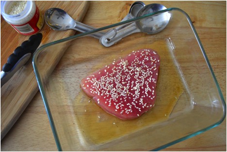 Tuna steak coated with oil and sesame seeds