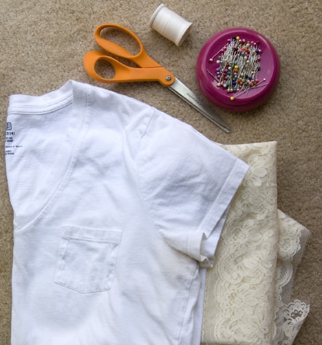 T shirt, lace, scissors, and pins flat lay