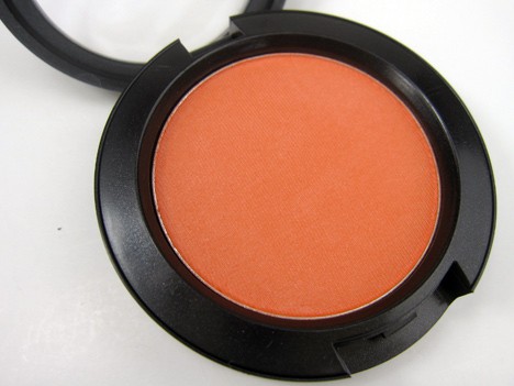 Modern Mandarin with a bright and light red orange shade and shimmery satin finish
