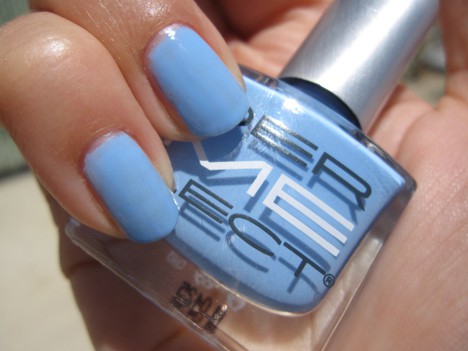 A hand with light cornflower blue nail polish
