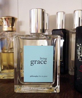 Philosophy Living Grade scent with fragrant bottles on the background