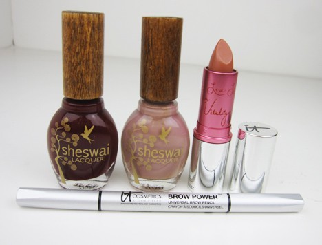 IT Cosmetics Lip Vitality Flush, Brow Power Universal Pencil and two different shades of Sheswai Nail Lacquer on a white background
