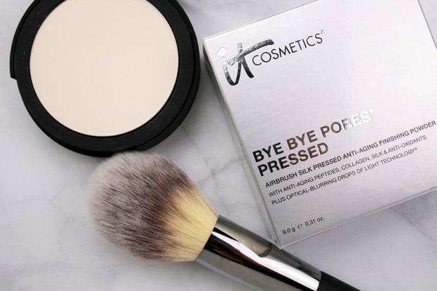 We Heart This shares IT Cosmetics Bye Bye Pores Pressed Poreless Finishing Powder blurs away all the signs of too many late nights in a quick swoop or two.