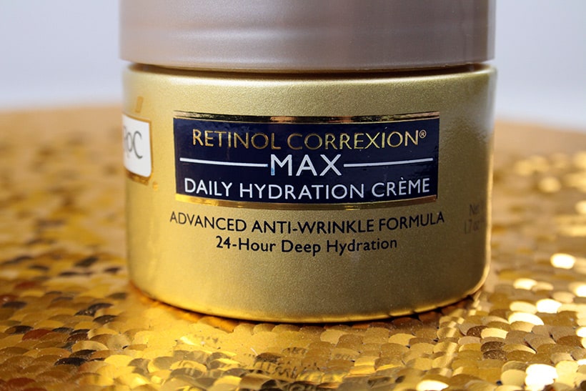 RoC Retinol Correxion Max Daily Hydration Crème on a gold glitter background