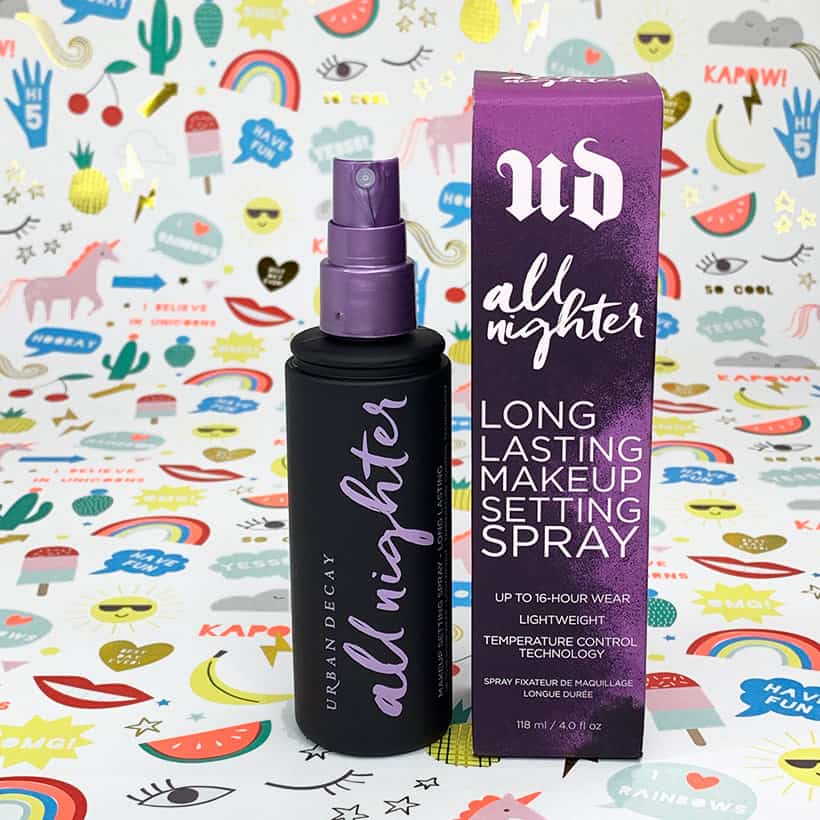 Urban decay all nighter setting spray with box on a colorful background