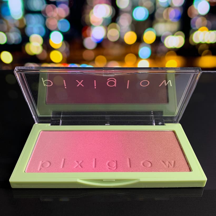  Pixi Beauty Pixiglow Cake in a blurred lights background