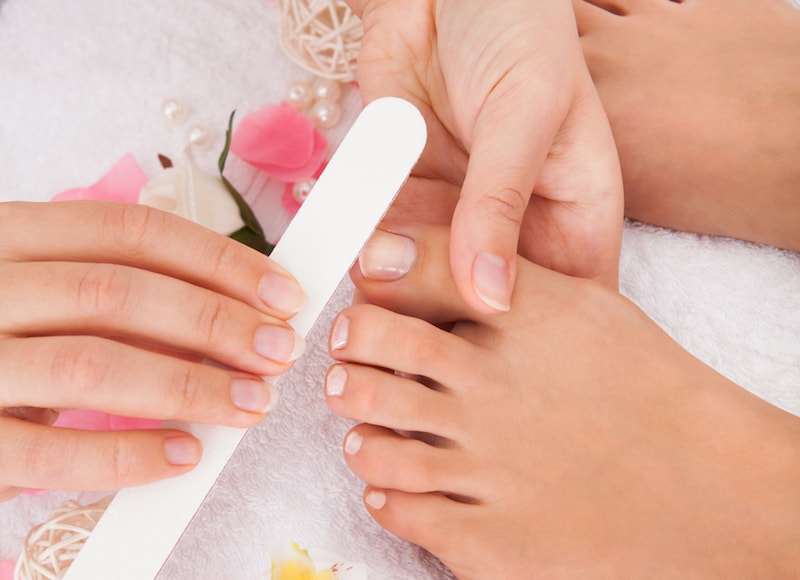 Professional pedicure using dieffenbach scalpel. Medical pedicure procedure  using special instrument. Treatment of calluses and skin fungus. Beauty &  Fashion Stock Photos