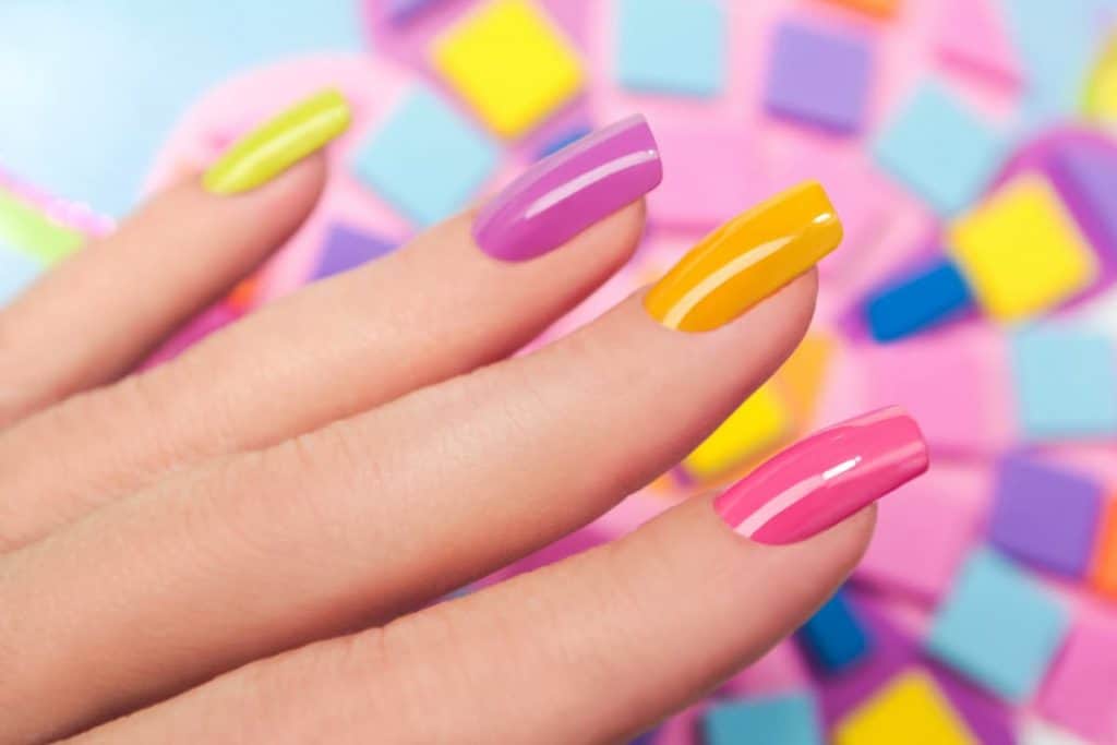 woman with a colorful silk wrap manicure