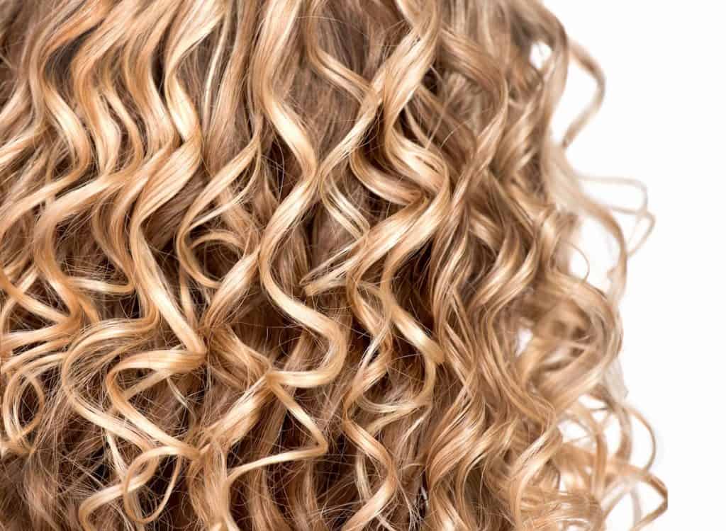 permed blonde curly hair
