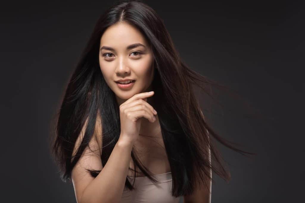 portrait of young Asian woman with beautiful and healthy dark hair
