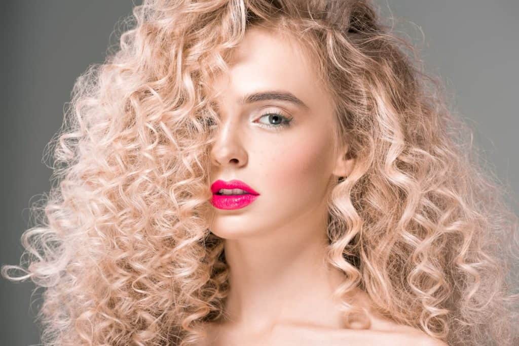 blonde lady with spiral curly hair