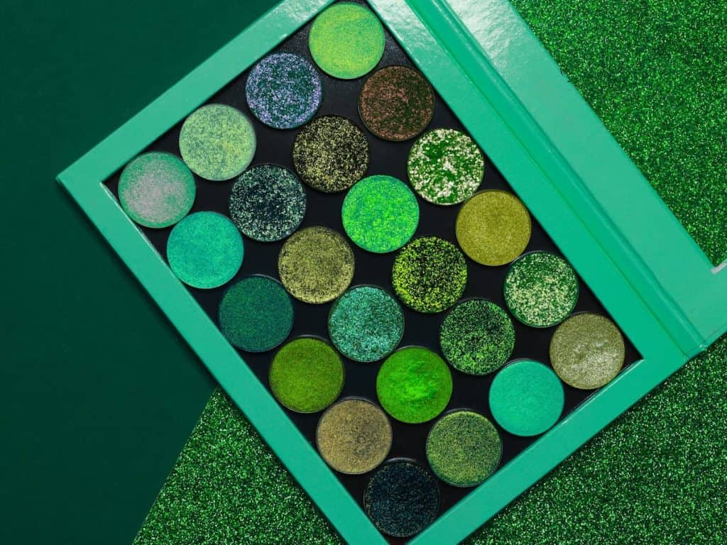 A green eyeshadow palette in a green box.