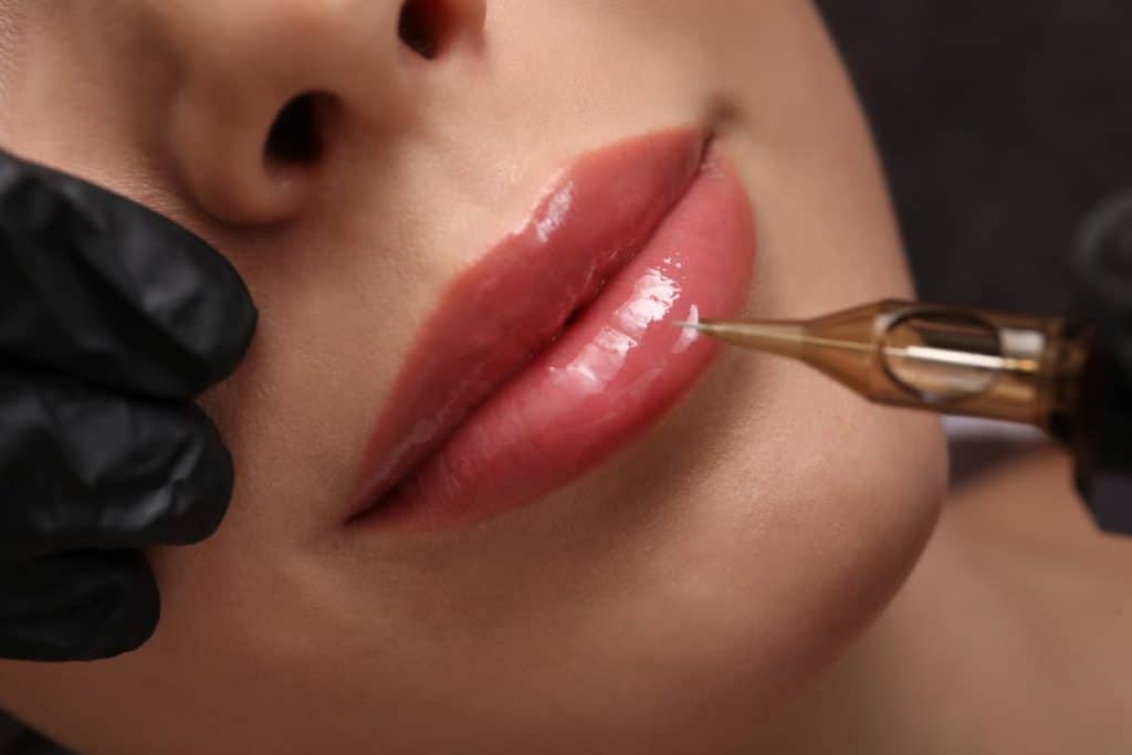 A close up photo of a woman's lip having a permanent tattoo makeup