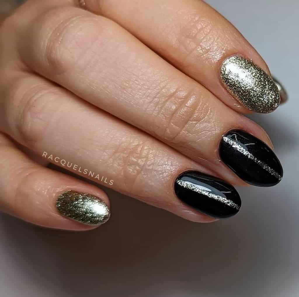A closeup of a woman's hand with a black nail polish that has gold glitters and thin glitter line