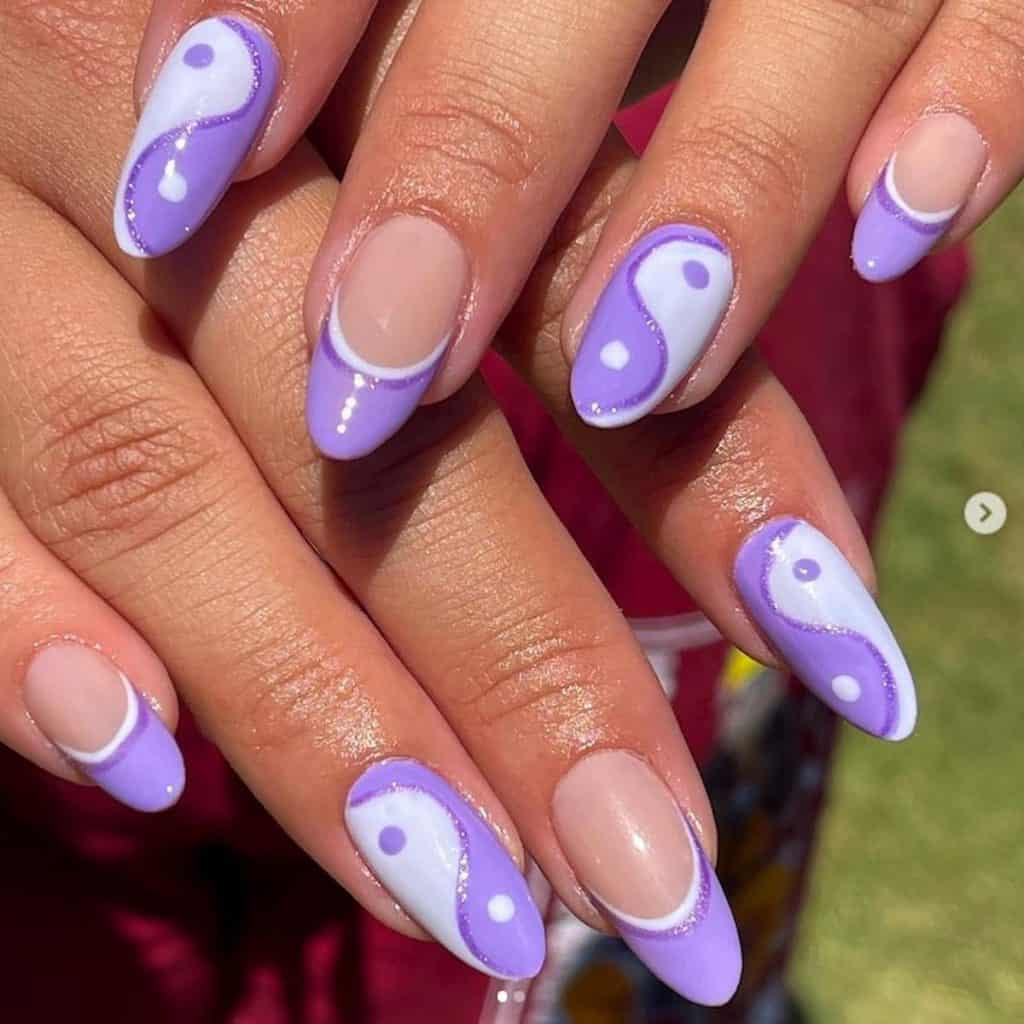 A lavender ying yang nail art with lavender glittery polish
