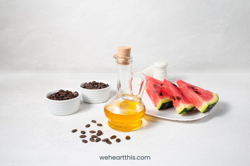 Watermelon seed oil in the bottle on white background