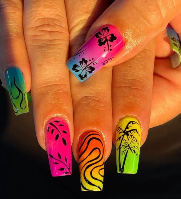 A woman's long nails with two contrasting tones blended to create a unique ombre effect that has coconut trees, flowers, flame art, and swirls nail designs