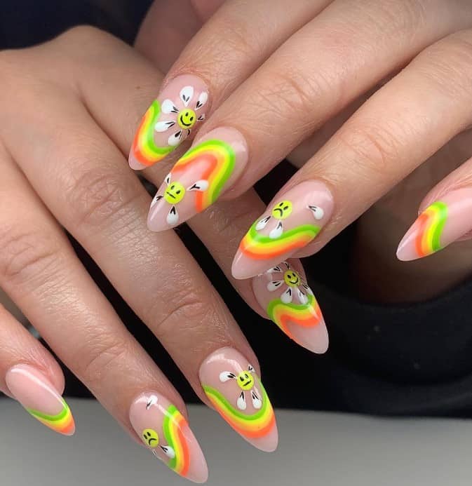 colorful rainbows with these long nails where daisies with sad and smiley faces decorate each nail