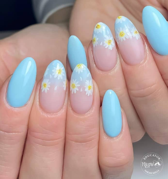 blue nails and blue ombre tips with daisy designs