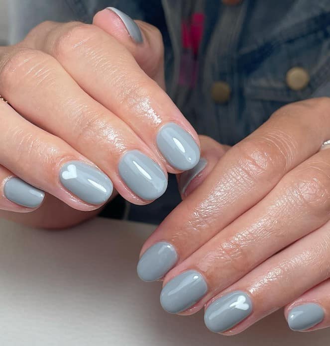 Premium Photo | Female hand with gray nail design. gray nail polish manicure.  woman hand on light gray fabric backgr