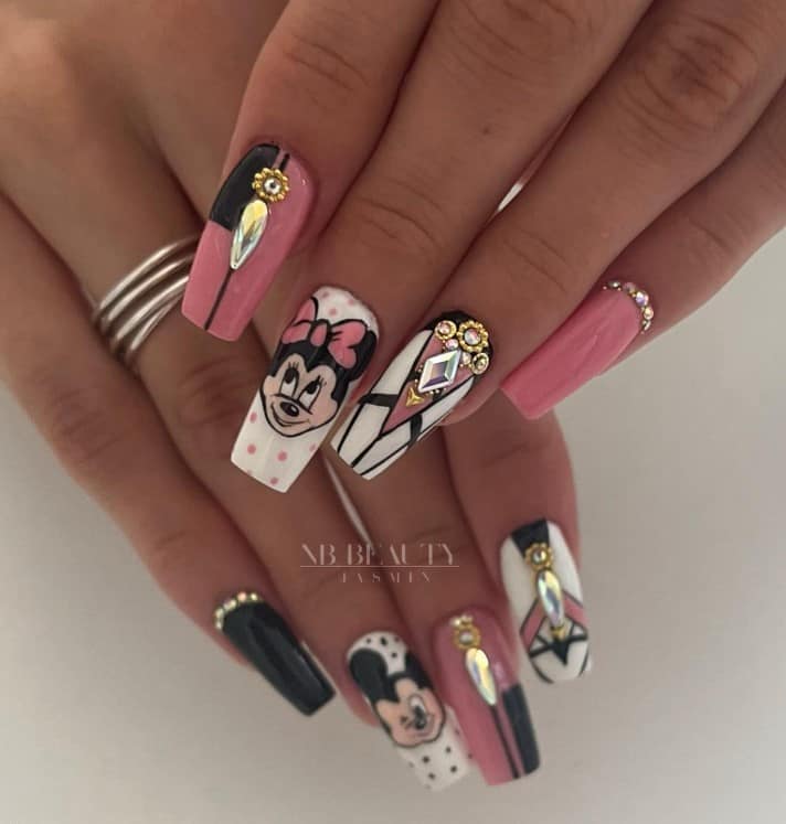 A woman's fingernails with black, white, and pink nails that has Mickey and Minnie Mouse against a polka dot background  nail designs