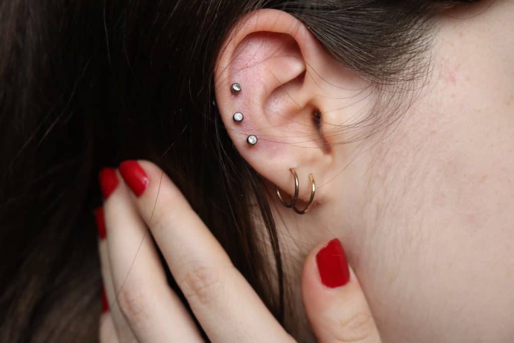 A woman with a piercings on her ear.
