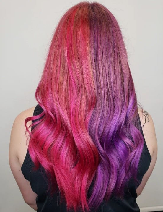 gorgeous long locks divided into two distinct sections of dark pink hue and vibrant purple