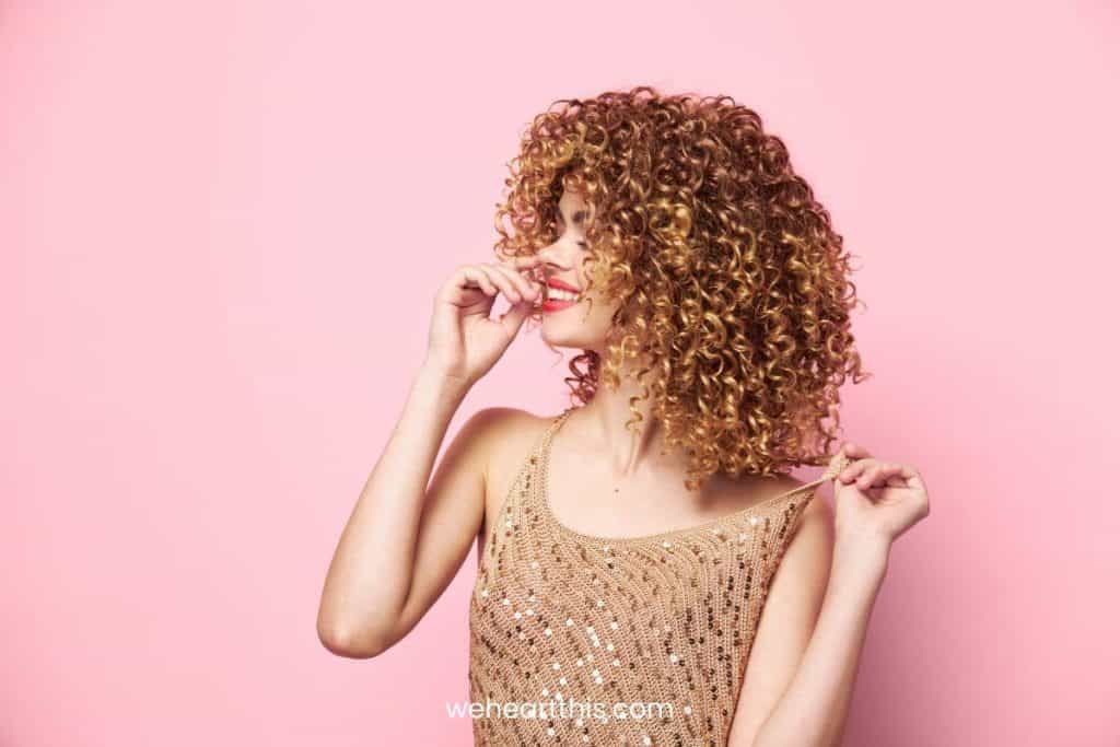 a beautiful young woman with defined curly hair