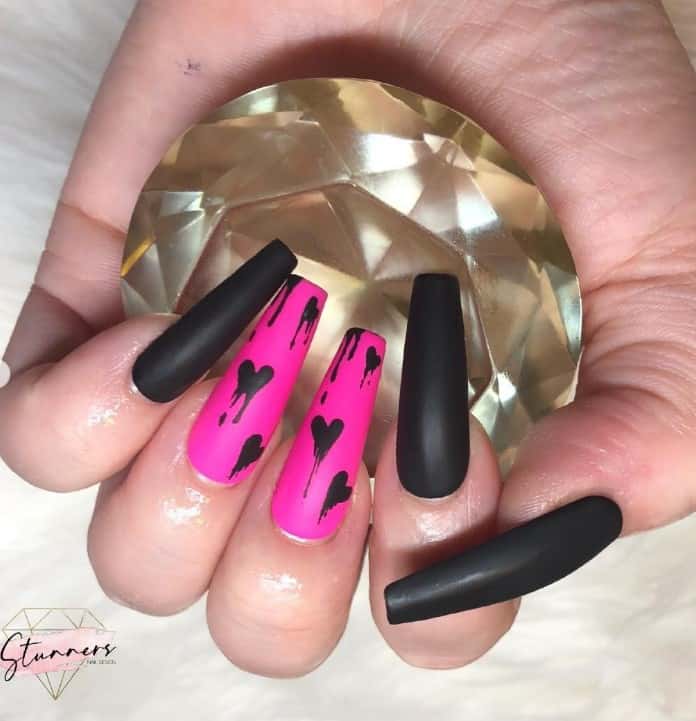 Premium Photo | Female hands with dark pink nail design