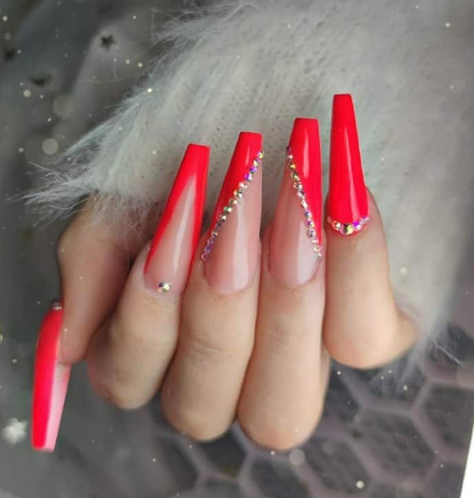 Some nails are solid red, while others feature side or V-shaped French tips in red