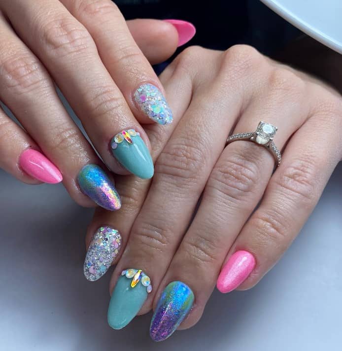 this set that features pink and blue nails, chunky glitter flakes, iridescent nail foil, and 3D gems