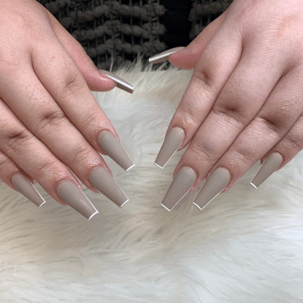 gray nails with incredibly thin outlines on the tips