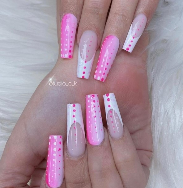 Pink and white polka dot nails in sculpted coffin nail shaped