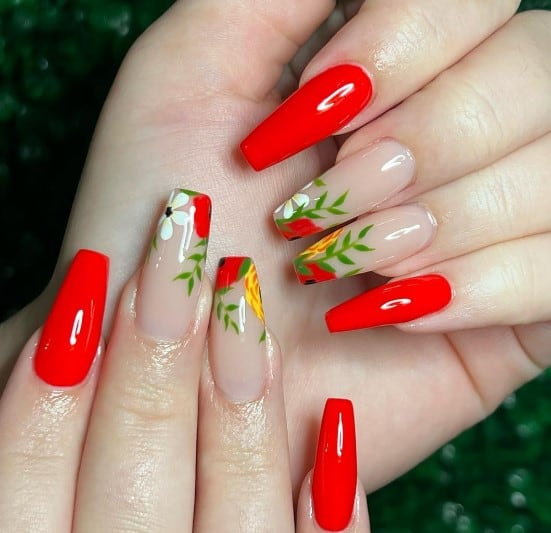 A woman's bright red polish with light beige accent nails and transform them into a garden by painting floral tips with red poppies, white daisies, yellow dahlias of white, and green leaves