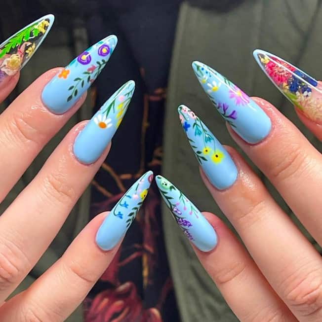 A woman's light blue nails with flowers