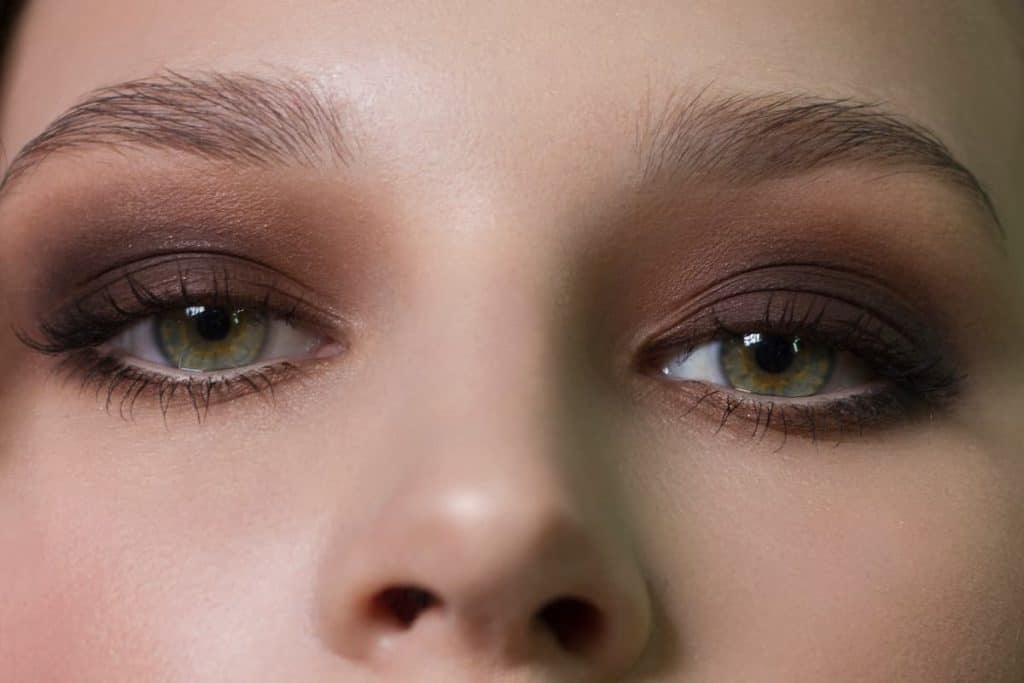A close up of a woman's eye makeup.