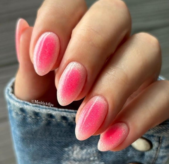 hot-pink ombré aura nail with a denim jacket.