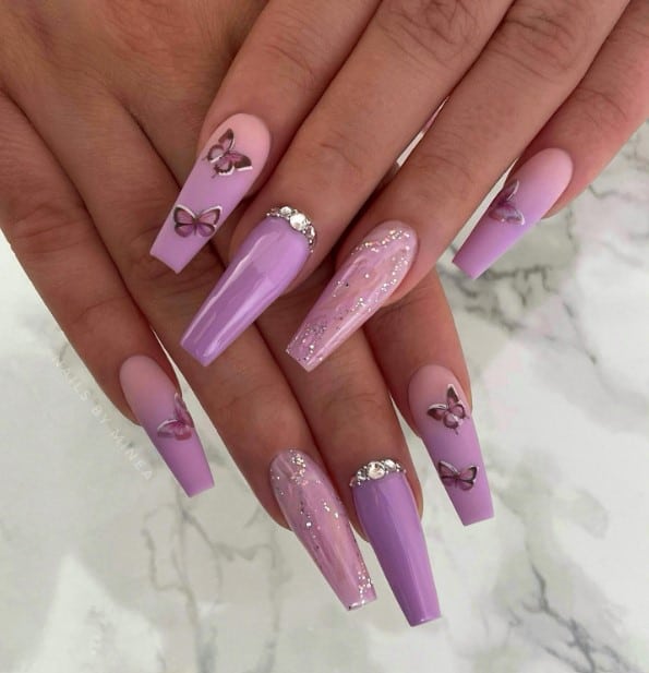 A woman's combining purple and light pink with a fun mix of textures with butterflies on them.