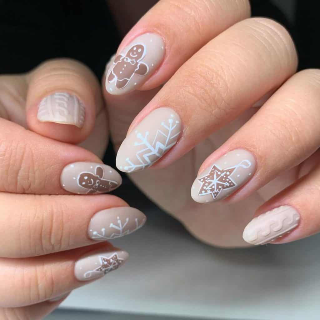 A woman's hand features sweater knit patterns, starry decorations, and delicate snowflakes, with the highlight being a charming gingerbread man. 