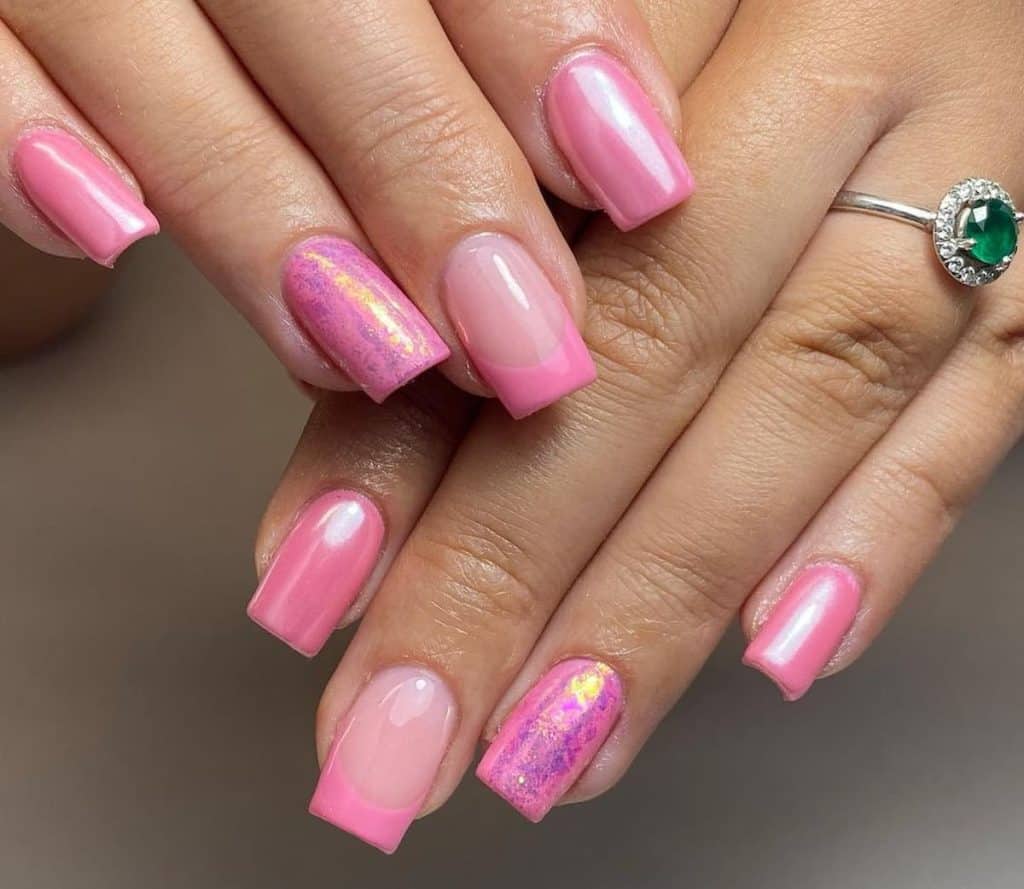 Pink French chrome nails offer a modern twist on a classic, with some topped with chic pink foil. 