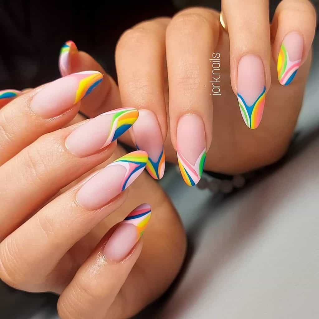 Pinkish matte nude nails are ready for summer fun, each featuring French tips lined with a rainbow of thin, wavy stripes in blue, pink, green, and neon green, bringing a splash of color to your look.