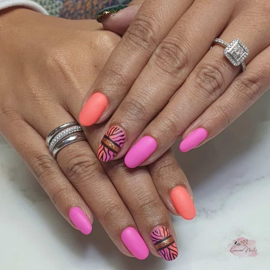 A woman's hot pink and coral in an ombré effect crowned with a bold zebra print and a touch of rose gold glitter