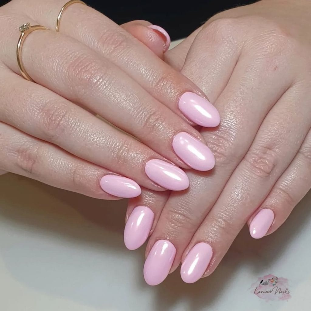 A woman's plain light pink chrome with a ring on them.