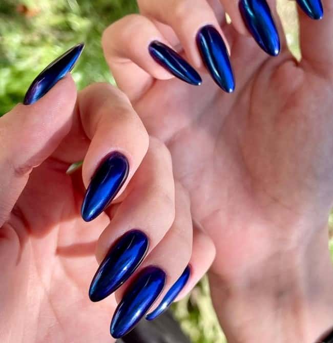 This blue almond nail design is destined to dazzle and features sapphire blue polish with a metallic sheen