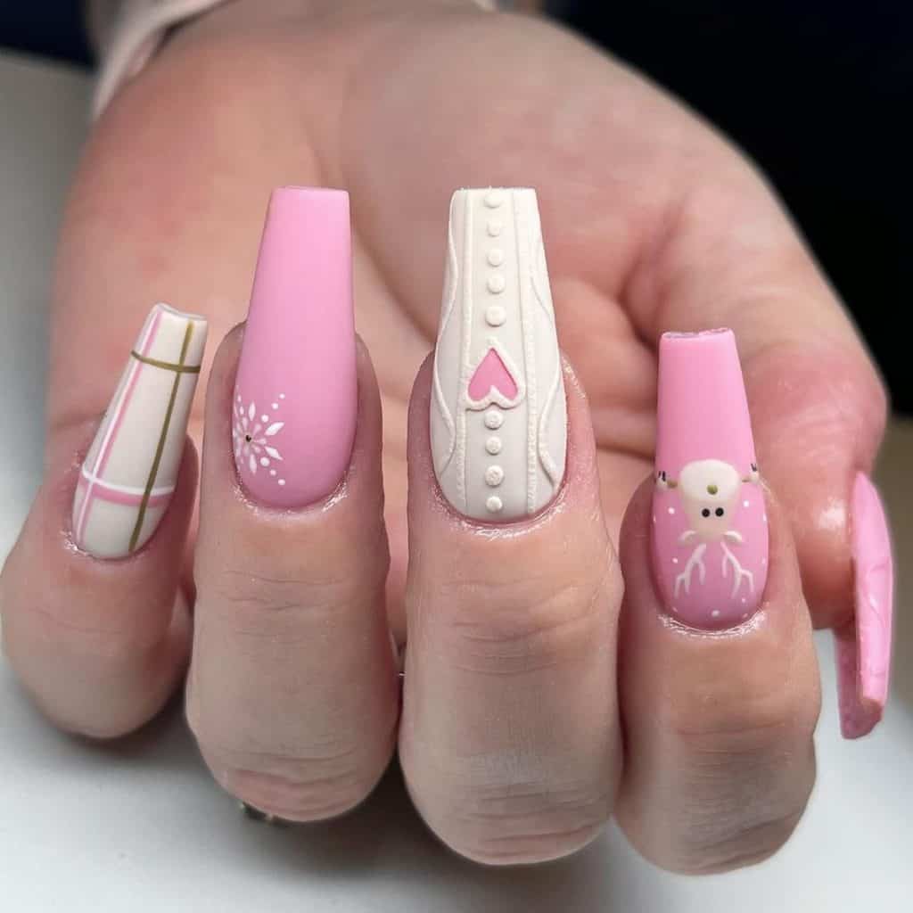 A woman's pink and white nails individually adorned with playful plaid, delicate snowflakes, cozy knit patterns, and adorable reindeer art